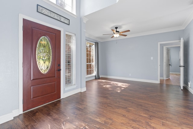 entryway featuring crown molding, ceiling fan, and dark hardwood / wood-style flooring