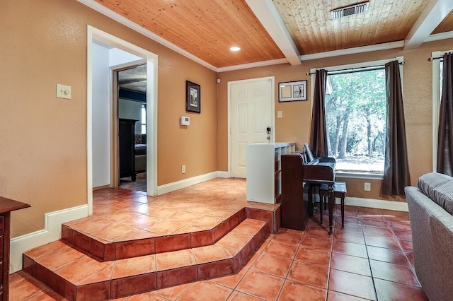 tiled foyer with beam ceiling and wood ceiling