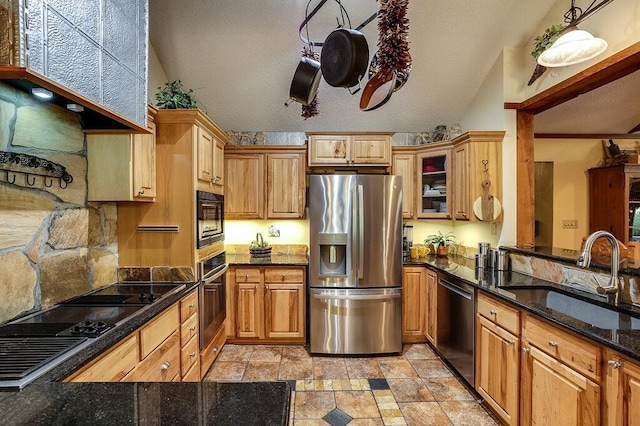 6040 Casey Ct, Fort Worth, TX 76140 - kitchen featuring glass insert cabinets, range hood, a sink, stone finish flooring, and appliances with stainless steel finishes