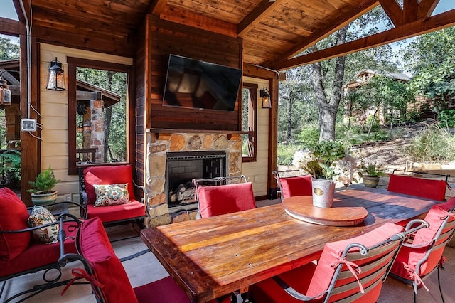 view of patio / terrace with an outdoor stone fireplace