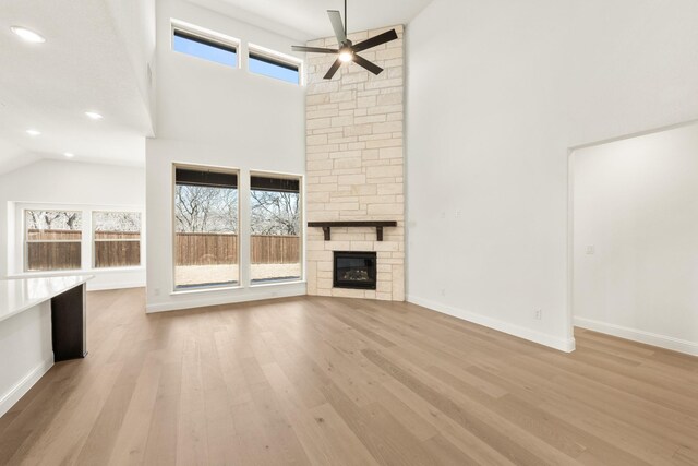 dining area with light hardwood / wood-style floors, lofted ceiling, and plenty of natural light