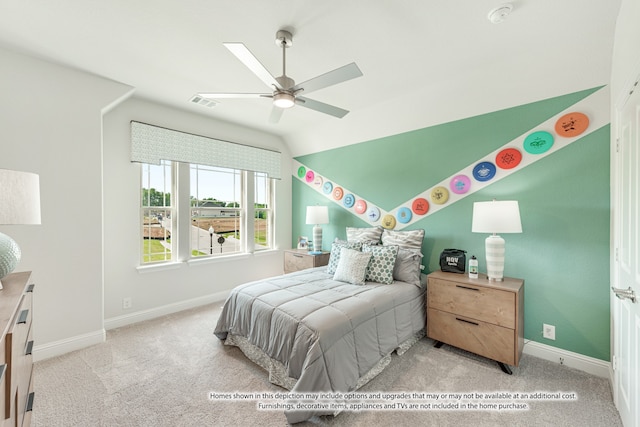 bedroom featuring lofted ceiling, light colored carpet, and ceiling fan