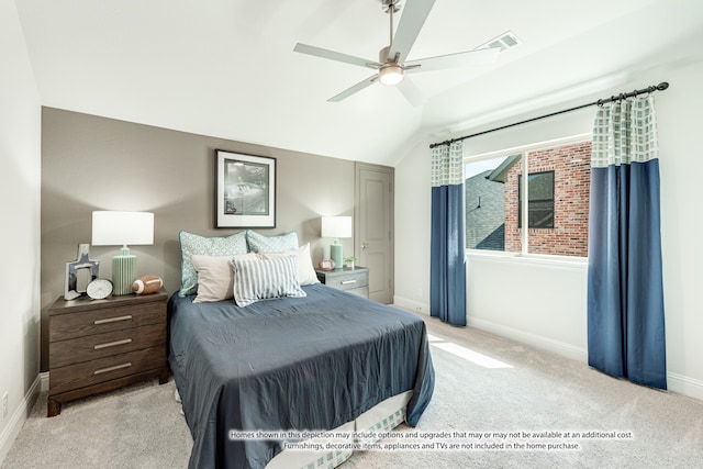 carpeted bedroom featuring lofted ceiling and ceiling fan