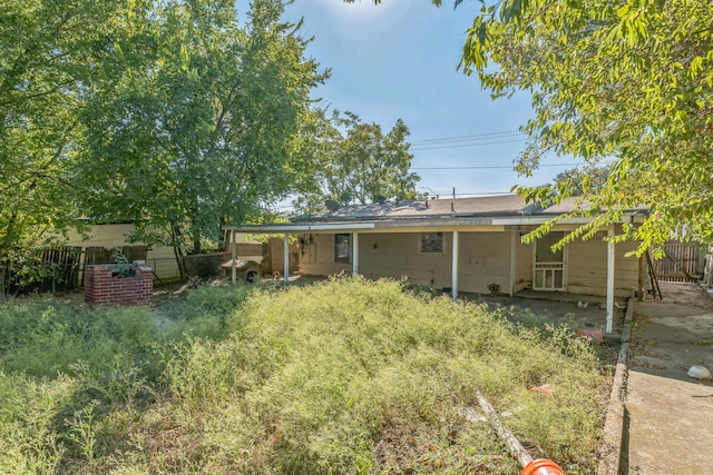 back of property featuring a patio