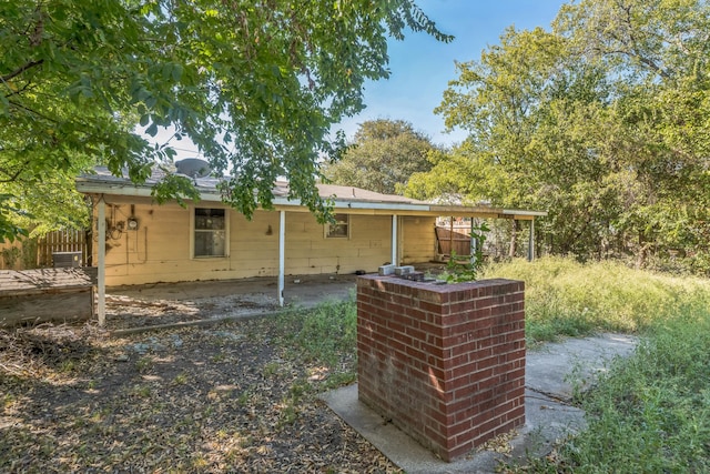 back of house featuring a patio area and central AC