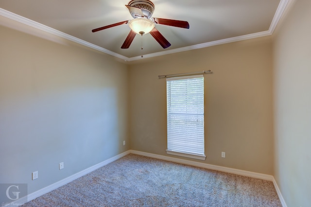 carpeted empty room featuring ornamental molding and ceiling fan