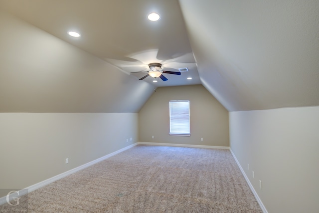 bonus room featuring lofted ceiling, carpet flooring, and ceiling fan