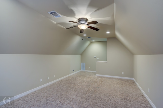 bonus room with ceiling fan, lofted ceiling, and light colored carpet