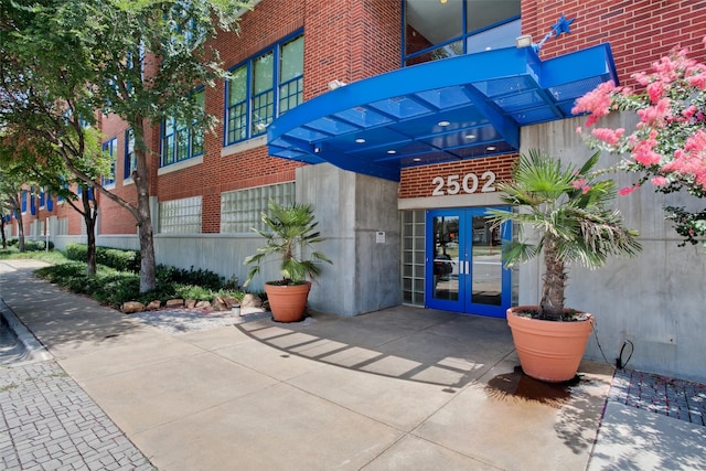 view of exterior entry featuring french doors