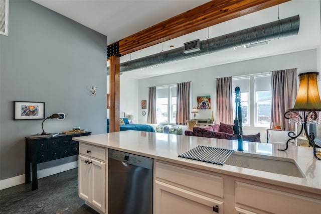 kitchen featuring white cabinets and dishwasher