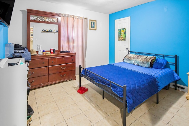 bedroom with light tile patterned floors