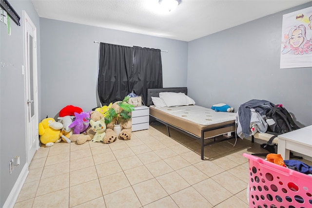 bedroom featuring light tile patterned floors