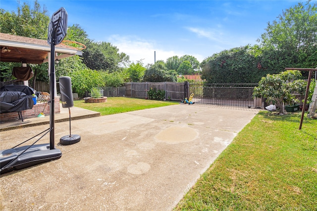 view of patio / terrace featuring an outdoor fire pit