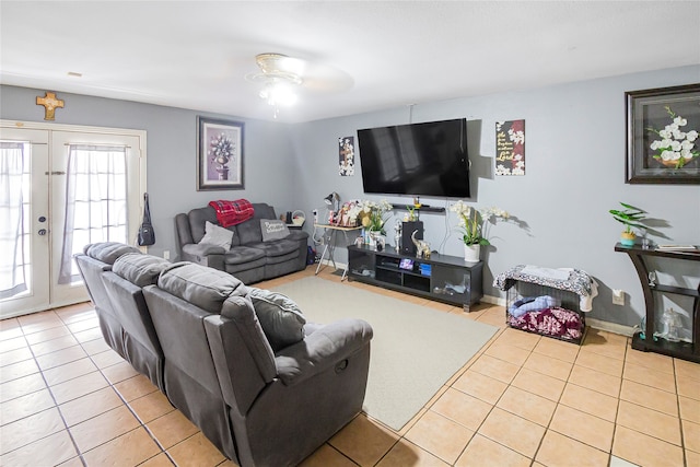 tiled living room with french doors and ceiling fan