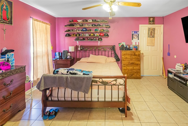 bedroom featuring light tile patterned floors and ceiling fan