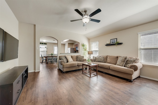 living room featuring hardwood / wood-style floors and ceiling fan