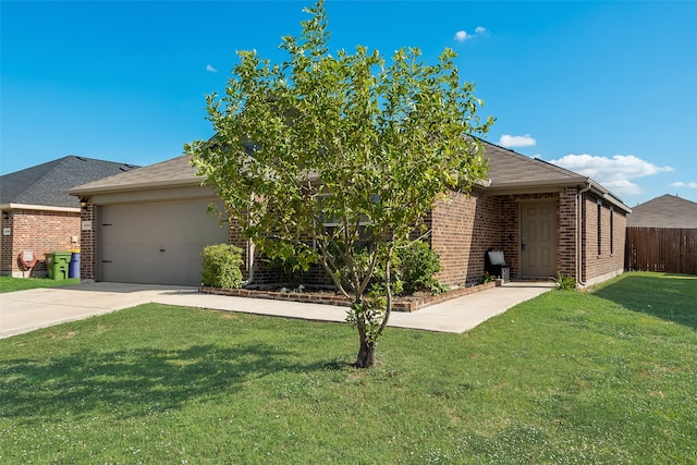 obstructed view of property with a front lawn and a garage