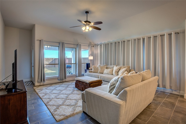 living room with ceiling fan and lofted ceiling