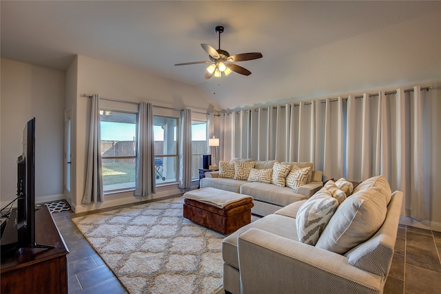 living room featuring ceiling fan and vaulted ceiling