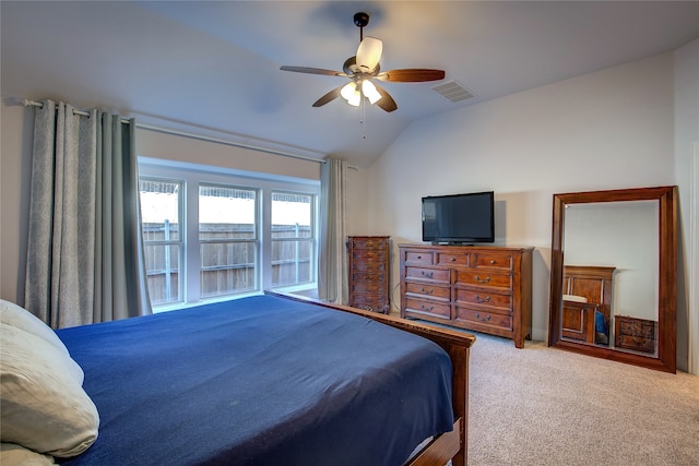 bedroom featuring ceiling fan, carpet floors, and vaulted ceiling