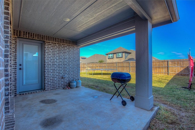 4035 Three Forks Rd, Kaufman, TX 75142 - view of patio featuring a trampoline and area for grilling