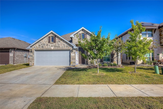 view of front of house with a front lawn and a garage