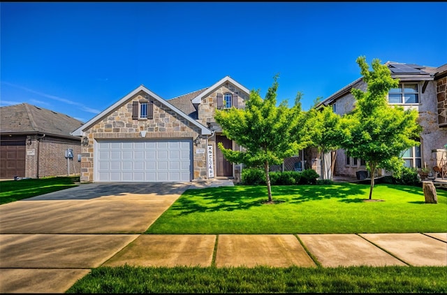 4035 Three Forks Rd, Kaufman, TX 75142 - view of front of property featuring stone siding, driveway, a garage, and a front lawn