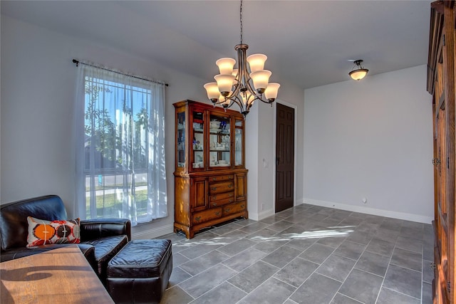 living area featuring a notable chandelier