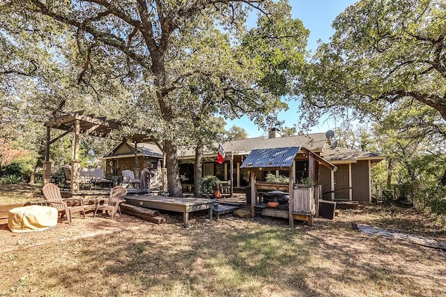 6040A Casey Ct, Fort Worth, TX 76140 - back of house with a chimney, roof with shingles, and a deck