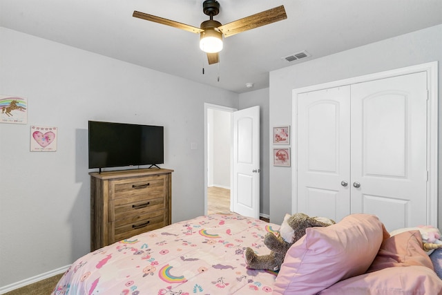 bedroom with a closet, carpet flooring, and ceiling fan