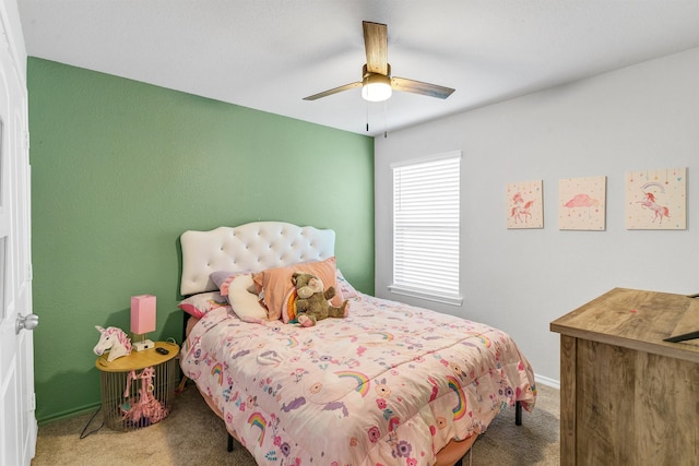 carpeted bedroom featuring ceiling fan