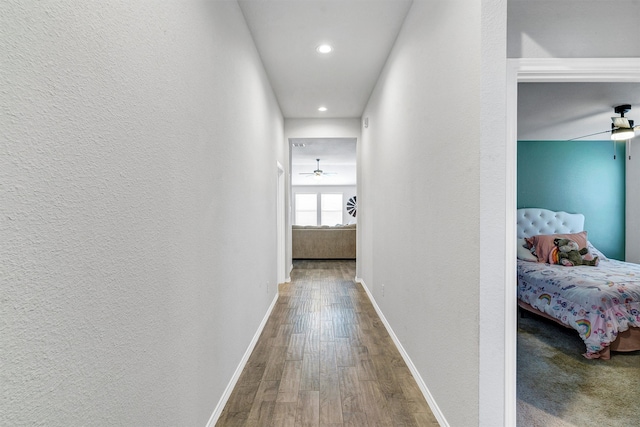 corridor with wood-type flooring