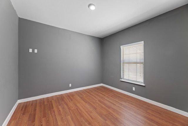 empty room featuring wood-type flooring