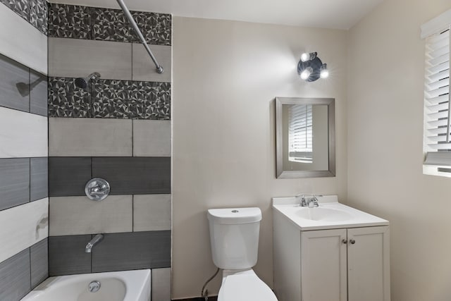 full bathroom featuring toilet, vanity, and tub / shower combination