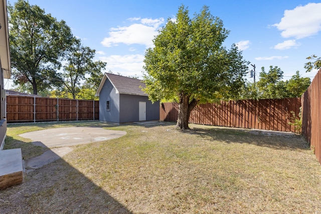 view of yard with a patio and a shed