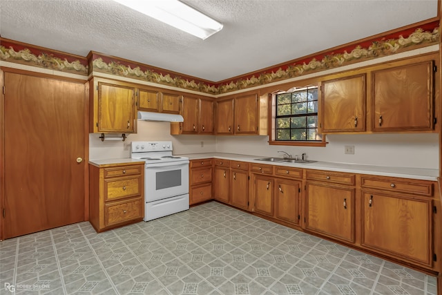 kitchen featuring a textured ceiling, sink, and electric stove