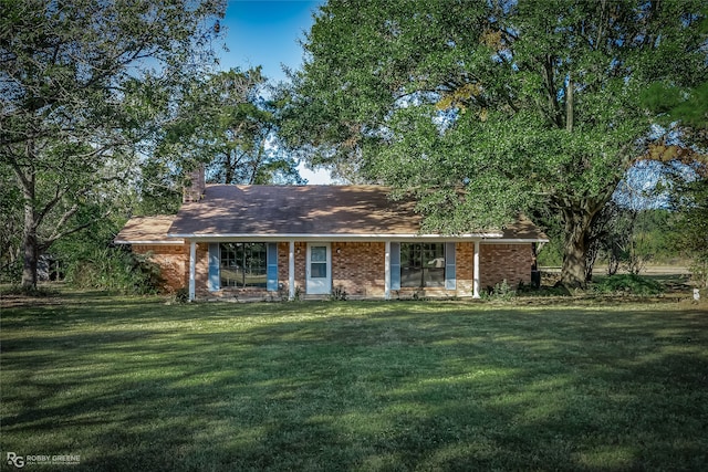 ranch-style house with a front lawn