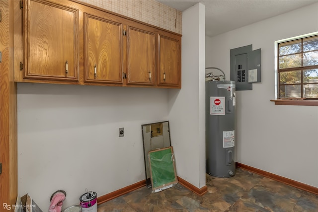 clothes washing area with hookup for an electric dryer, water heater, electric panel, and cabinets