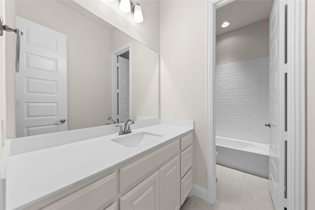 bathroom featuring vanity, tile patterned floors, and bathing tub / shower combination