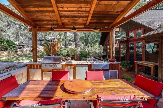 6048 Casey Ct, Fort Worth, TX 76140 - view of patio featuring a sink, an outdoor kitchen, outdoor dining area, and a grill