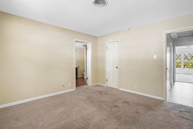 empty room featuring carpet floors