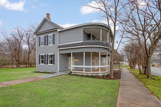 view of front of house featuring a porch and a front yard