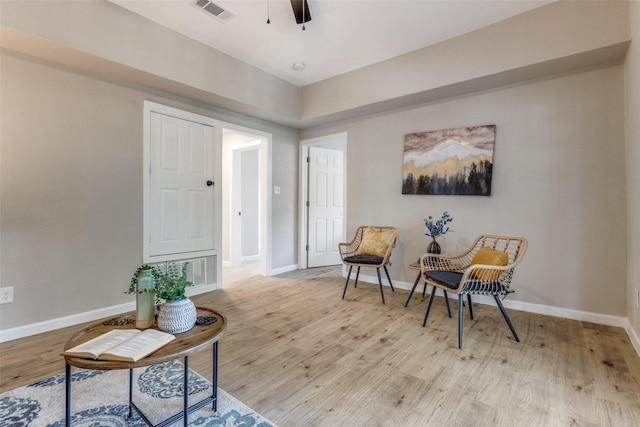 sitting room featuring light hardwood / wood-style floors