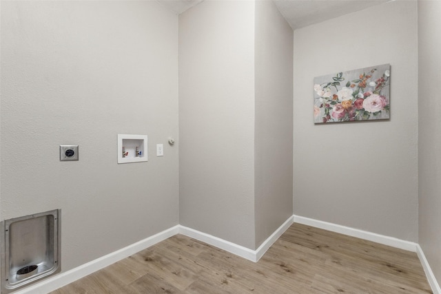 laundry room with light hardwood / wood-style floors, hookup for a washing machine, and electric dryer hookup