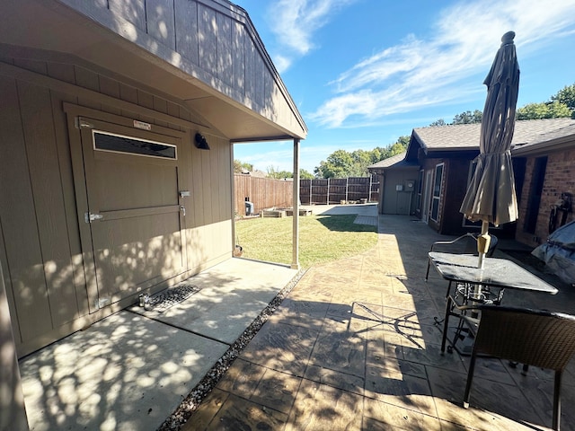 view of patio / terrace featuring a storage shed