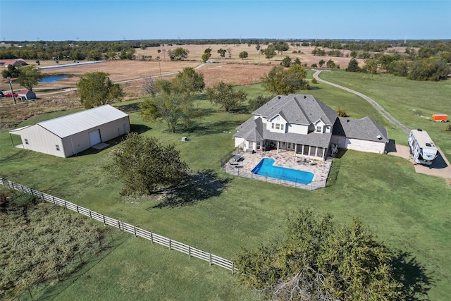 birds eye view of property featuring a rural view