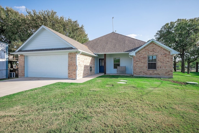 single story home featuring a front lawn and a garage