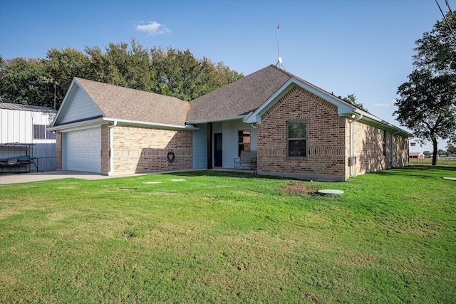 ranch-style home featuring a front yard and a garage