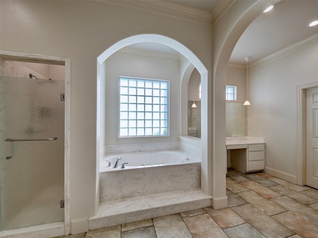 bathroom featuring vanity, ornamental molding, and shower with separate bathtub