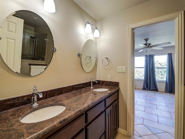 bathroom with vanity, tile patterned flooring, a shower, and ceiling fan